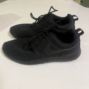 Women’s black Nike Roshe One running shoe